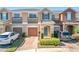 Two-story townhome with attached garage and landscaped front yard at 812 Park Grove Ct, Orlando, FL 32828