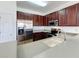 Modern kitchen with stainless steel appliances and wood cabinets at 812 Park Grove Ct, Orlando, FL 32828