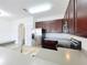 Modern kitchen with stainless steel appliances and a breakfast bar at 812 Park Grove Ct, Orlando, FL 32828