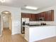 Kitchen features stainless steel appliances and wood cabinets at 812 Park Grove Ct, Orlando, FL 32828