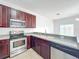 Kitchen with stainless steel appliances and a double sink at 812 Park Grove Ct, Orlando, FL 32828