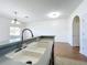 Kitchen with double sink and dark wood cabinets at 812 Park Grove Ct, Orlando, FL 32828