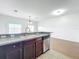 Kitchen with stainless steel appliances and a view to the lake at 812 Park Grove Ct, Orlando, FL 32828