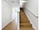 Wooden staircase with white railings and neutral walls at 812 Park Grove Ct, Orlando, FL 32828