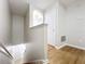 Wooden staircase and hallway with neutral walls at 812 Park Grove Ct, Orlando, FL 32828