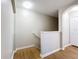 Wooden staircase and hallway with neutral walls at 812 Park Grove Ct, Orlando, FL 32828