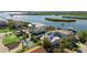 Aerial view of waterfront home with private dock and boat lift at 830 Garfish Ave, New Smyrna Beach, FL 32169
