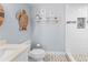 Bathroom with toilet, sink, and walk-in shower at 830 Garfish Ave, New Smyrna Beach, FL 32169
