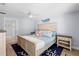 Main bedroom with a king-size bed and ensuite bathroom at 830 Garfish Ave, New Smyrna Beach, FL 32169
