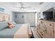 King bed, dresser, and access to a private balcony at 830 Garfish Ave, New Smyrna Beach, FL 32169