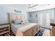 Spacious bedroom with king-size bed and private balcony access at 830 Garfish Ave, New Smyrna Beach, FL 32169
