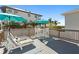 Relaxing deck with patio furniture, umbrellas, and views at 830 Garfish Ave, New Smyrna Beach, FL 32169