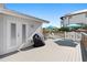Relaxing deck with outdoor furniture and grill at 830 Garfish Ave, New Smyrna Beach, FL 32169