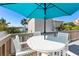 Relaxing deck with patio furniture and waterfront views at 830 Garfish Ave, New Smyrna Beach, FL 32169