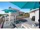 Outdoor deck features dining furniture and grill at 830 Garfish Ave, New Smyrna Beach, FL 32169