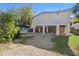 Elevated home with covered parking and fenced yard at 830 Garfish Ave, New Smyrna Beach, FL 32169