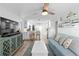 Open concept living and kitchen area with coastal decor at 830 Garfish Ave, New Smyrna Beach, FL 32169