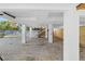 Elevated home with covered parking and gravel driveway at 830 Garfish Ave, New Smyrna Beach, FL 32169