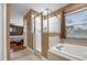 Bathroom with shower, bathtub and tile flooring at 8567 Baywood Vista Dr, Orlando, FL 32810