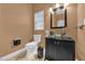 Clean bathroom with glass sink and dark vanity at 8567 Baywood Vista Dr, Orlando, FL 32810
