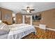 Bright bedroom with wood floors, ceiling fan and en-suite bathroom at 8567 Baywood Vista Dr, Orlando, FL 32810