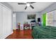 Bedroom with double bed, desk, and ceiling fan at 8567 Baywood Vista Dr, Orlando, FL 32810