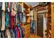 Large walk-in closet with ample shelving and safe at 8567 Baywood Vista Dr, Orlando, FL 32810