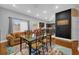 Open dining area with glass table and hardwood floors at 8567 Baywood Vista Dr, Orlando, FL 32810
