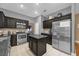 Modern kitchen with stainless steel appliances and granite countertops at 8567 Baywood Vista Dr, Orlando, FL 32810