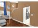 Open living space with hardwood floors, and view into kitchen at 8567 Baywood Vista Dr, Orlando, FL 32810