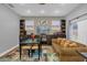 Spacious living room with hardwood floors and built-in shelving at 8567 Baywood Vista Dr, Orlando, FL 32810
