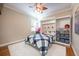 Bedroom with a queen bed, built-in shelving, and a ceiling fan at 863 Strathmore Dr, Orlando, FL 32803