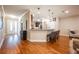 Bright and airy entryway with hardwood floors and a view to the kitchen and living areas at 863 Strathmore Dr, Orlando, FL 32803