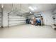 Clean and spacious garage with overhead storage and epoxy flooring at 863 Strathmore Dr, Orlando, FL 32803
