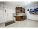 Well-organized garage workshop featuring custom cabinetry, sink, and ample storage at 863 Strathmore Dr, Orlando, FL 32803