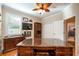 Home office features a large desk, hardwood floors, and built-in shelving at 863 Strathmore Dr, Orlando, FL 32803