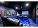 State-of-the-art home theater with reclining seats and ambient blue lighting at 863 Strathmore Dr, Orlando, FL 32803
