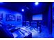 Home theater with large screen, comfortable seating, and a projector at 863 Strathmore Dr, Orlando, FL 32803