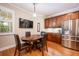 Breakfast nook area in kitchen with dark wood table and chairs at 863 Strathmore Dr, Orlando, FL 32803