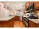 Kitchen boasts granite countertops and stainless steel appliances at 863 Strathmore Dr, Orlando, FL 32803