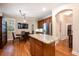 Kitchen features granite island, hardwood floors, and breakfast nook at 863 Strathmore Dr, Orlando, FL 32803