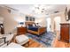 Main bedroom with hardwood floors, ceiling fan, and plenty of natural light at 863 Strathmore Dr, Orlando, FL 32803