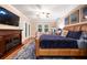 Luxurious main bedroom with hardwood floors, fireplace, and ample seating at 863 Strathmore Dr, Orlando, FL 32803
