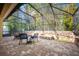 Relaxing screened patio with paver stones and built-in fire pit at 863 Strathmore Dr, Orlando, FL 32803