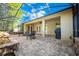 Screened patio with paver stones, fire pit, and outdoor seating at 863 Strathmore Dr, Orlando, FL 32803