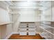Well-organized walk-in closet with built-in shelves and drawers at 863 Strathmore Dr, Orlando, FL 32803
