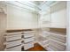 Large walk-in closet with ample shelving and drawers for storage at 863 Strathmore Dr, Orlando, FL 32803
