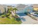 Two-unit building with attached garages and landscaping at 906 Coral Reef Way, Daytona Beach, FL 32124