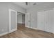 Bedroom with double doors and wood-look flooring at 906 Coral Reef Way, Daytona Beach, FL 32124