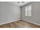 Bedroom with wood-look flooring and window shutters at 906 Coral Reef Way, Daytona Beach, FL 32124
